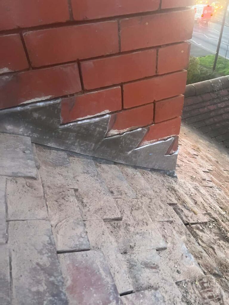 This is a photo of new leadwork being installed around an old chimney. Works carried out by TRP Roofing South Cave